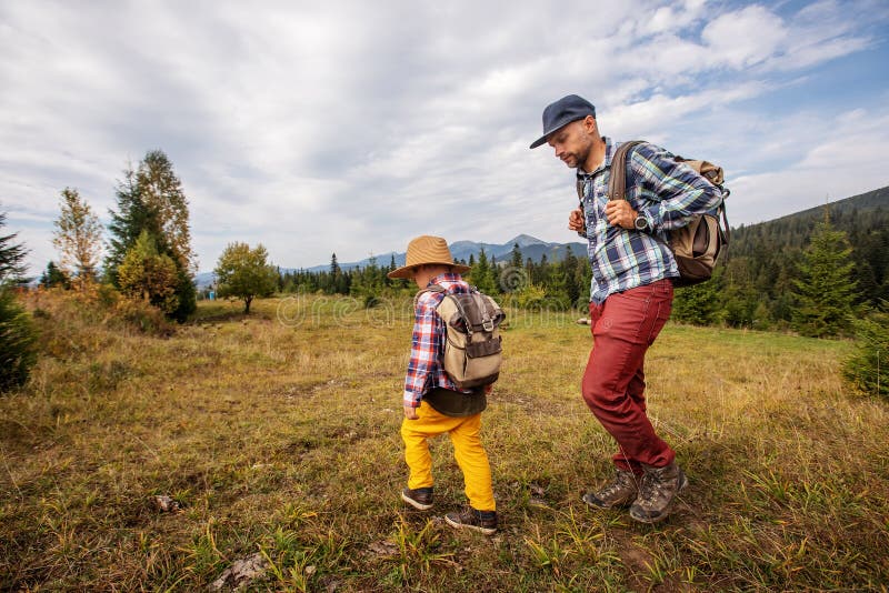 Happy family resting in the mountains in autumn royalty free stock photos
