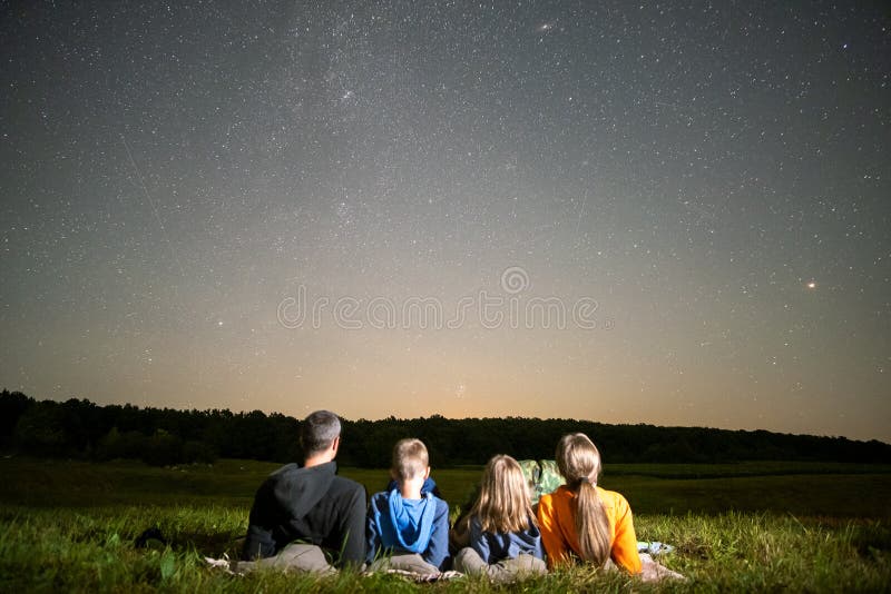 Family Watching Starry Night Sky Stock Image - Image of peaceful ...