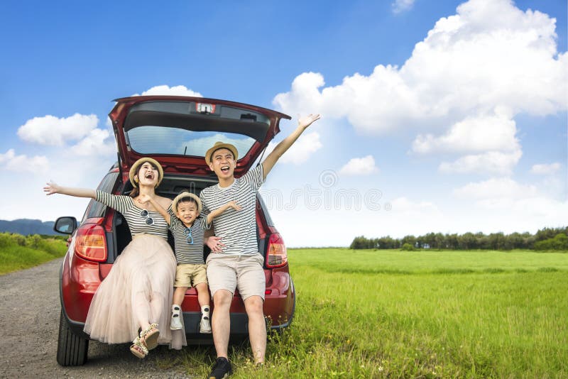 Happy family on  road trip in the car. having fun with summer vacation.