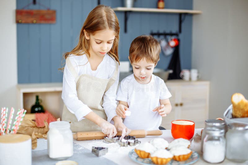 Happy Family in the Kitchen. Mother and Her Cute Kids are Cooking ...