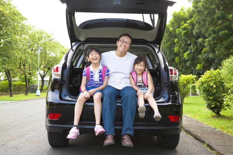 Happy asian family sitting in the car. Happy asian family sitting in the car