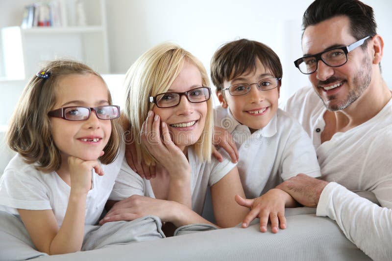 Family of four wearing eyeglasses