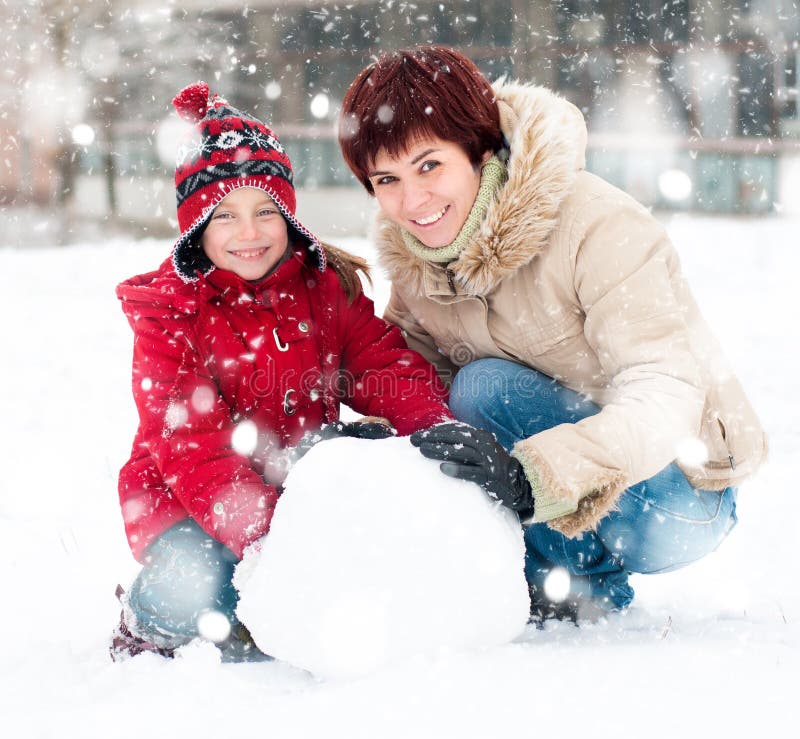 Happy family with snowman