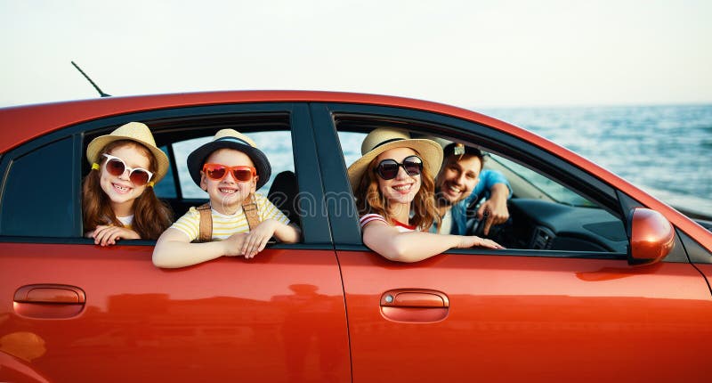 Happy family in summer auto journey travel by car on beach stock photos Happy family in summer auto journey travel by car on beach stock photos