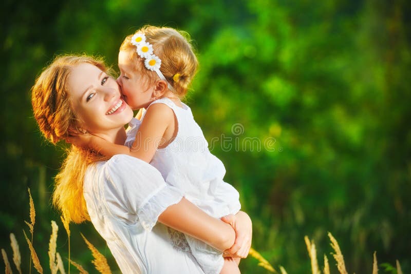 Happy family on summer. little girl child baby daughter hugging