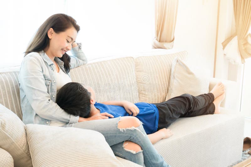 Happy family time. Mother and son relaxing in living room royalty free stock photo Happy family time. Mother and son relaxing in living room royalty free stock photo