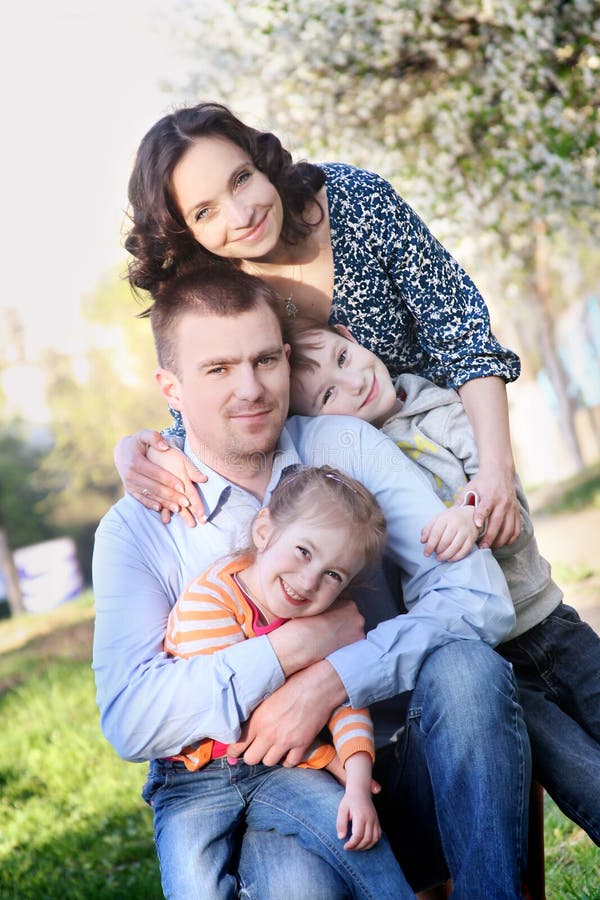 Happy family with two children in spring