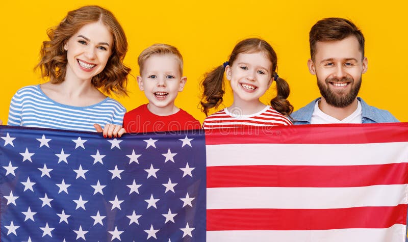 Happy family with the USA flag royalty free stock image Happy family with the USA flag royalty free stock image