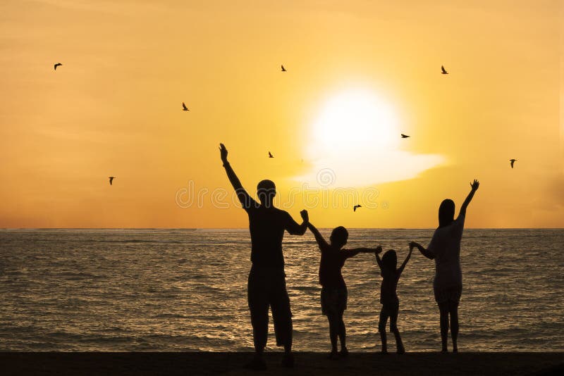 Happy family watching sunset