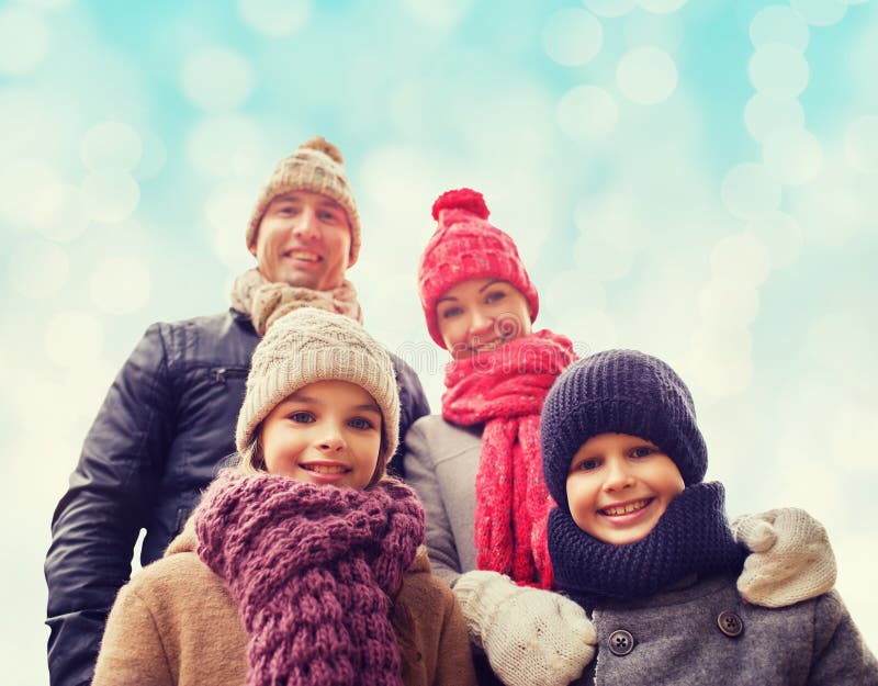 Happy family in winter clothes outdoors