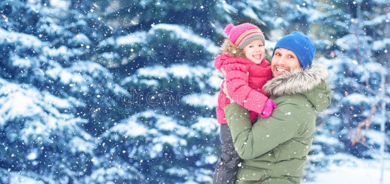 Happy family on winter walk. Dad and child baby girl royalty free stock photo Happy family on winter walk. Dad and child baby girl royalty free stock photo