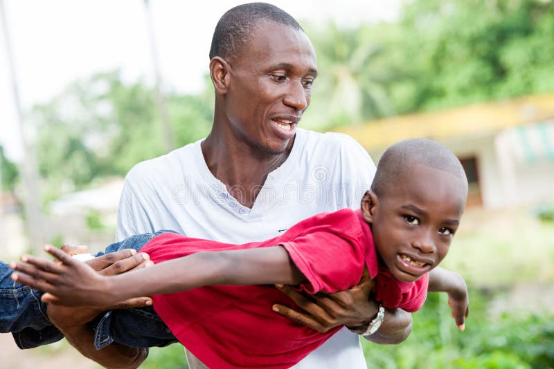 Happy father and little son playing and having fun outdoors royalty free stock image Happy father and little son playing and having fun outdoors royalty free stock image
