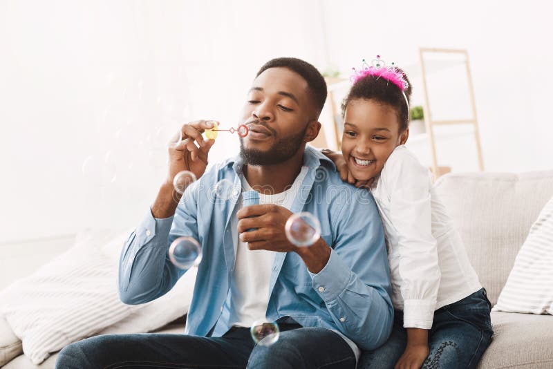 Happy Father`s Day! Man And His Daughter Blowing Soap Bubbles royalty free stock images Happy Father`s Day! Man And His Daughter Blowing Soap Bubbles royalty free stock images