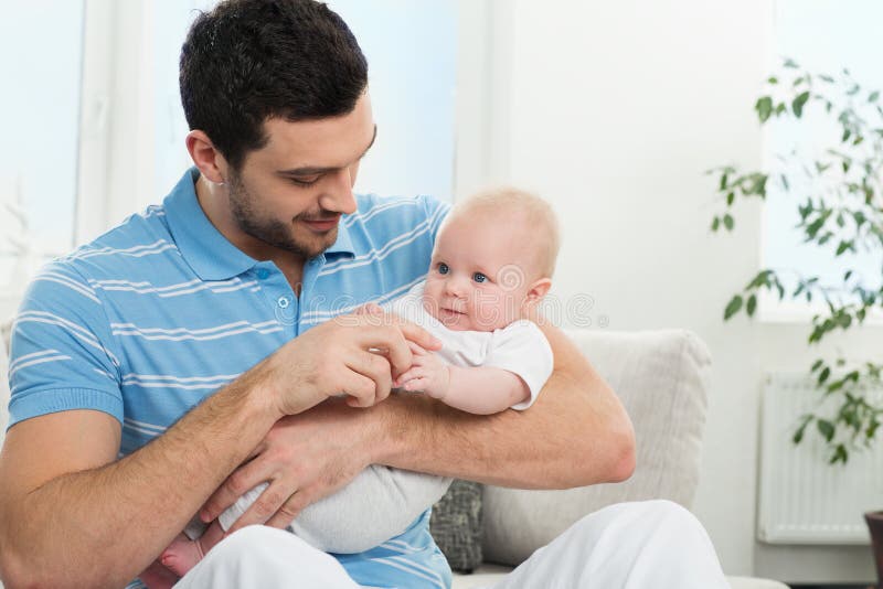 Father sit. Счастливый отец. Ребенок сидит на руках у папы. Sad Baby with father.