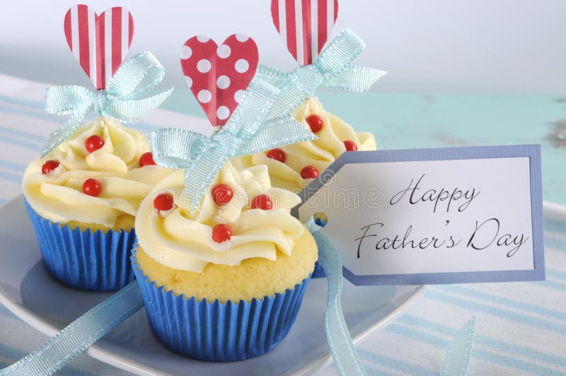 Happy Fathers Day bright and cheery red white and blue decorated cupcakes - closeup