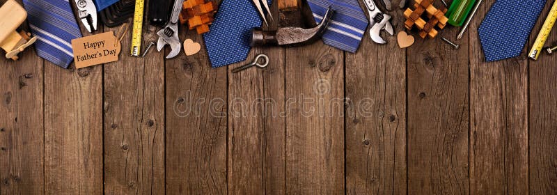 Happy Fathers Day gift tag with top border of gifts, ties and tools on a rustic wood banner background. Above view with copy space. Happy Fathers Day gift tag with top border of gifts, ties and tools on a rustic wood banner background. Above view with copy space