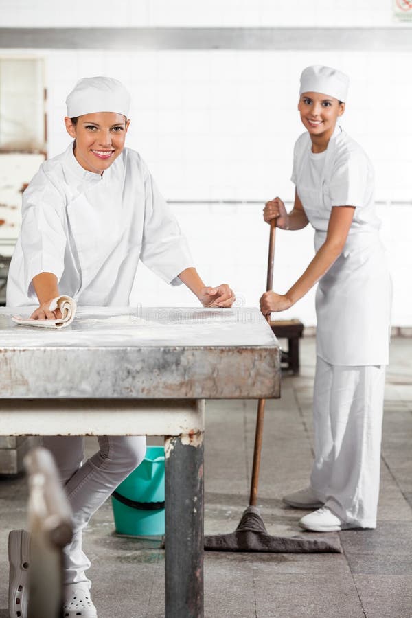 Portrait Female Baker Cleaning Flour Table Stock Photos Free