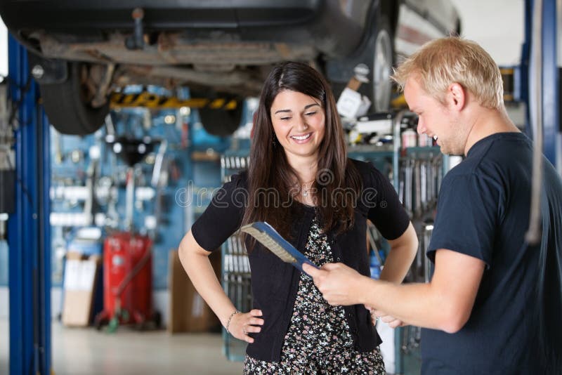 Happy Female Customer at Mechanic