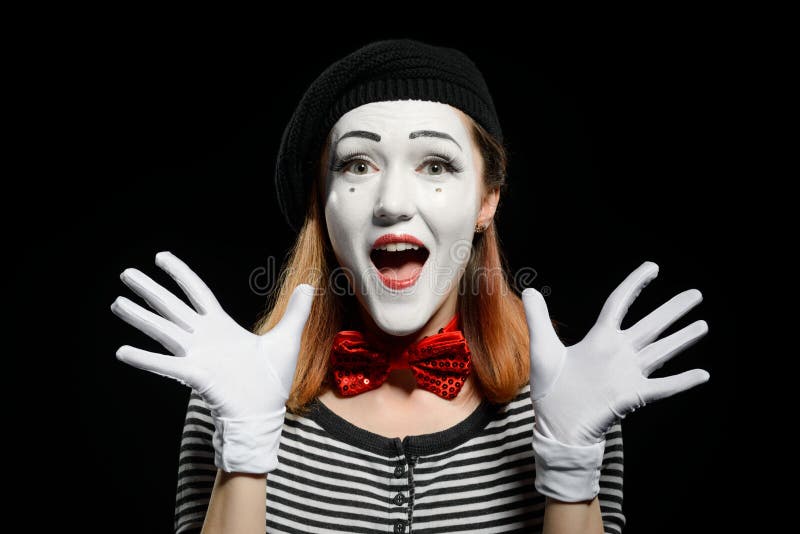 Happy female mime on black stock image. Image of mime - 129201945