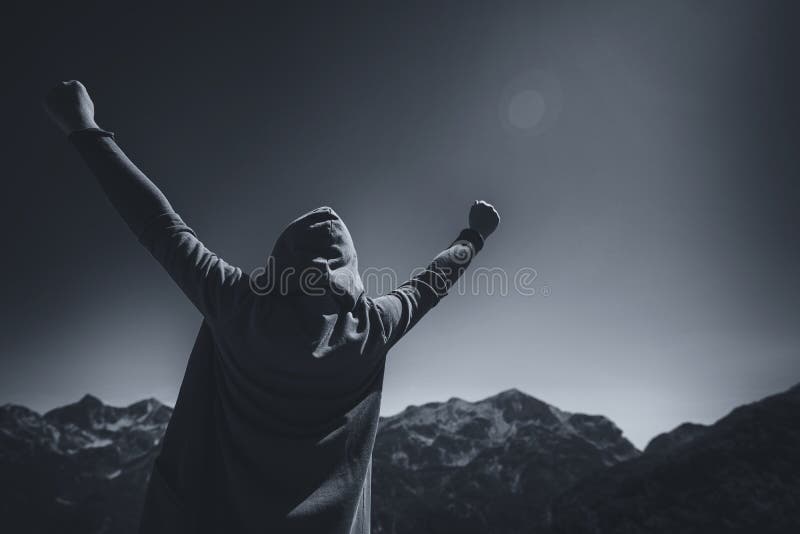 Happy female traveler with hands raised at mountain top royalty free stock photos Happy female traveler with hands raised at mountain top royalty free stock photos