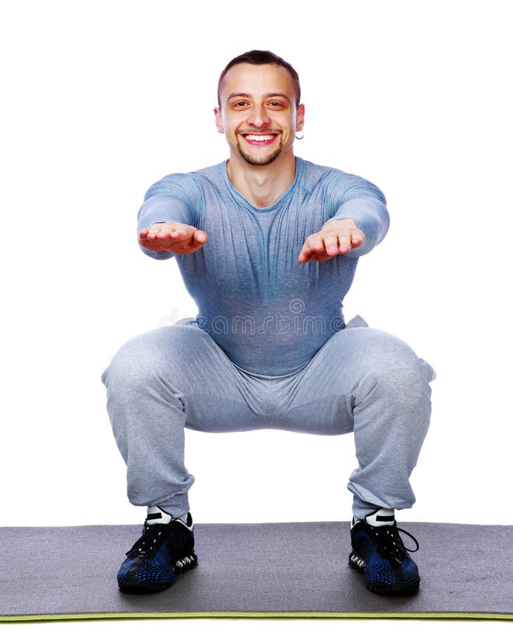 Happy fit man doing squats royalty free stock images Happy fit man doing squats royalty free stock images