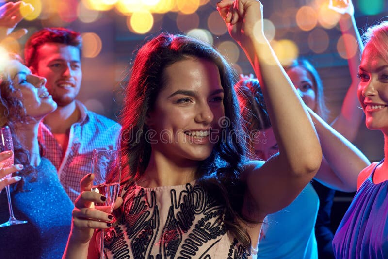 Happy Friends with Champagne Dancing at Nightclub Stock Photo - Image ...