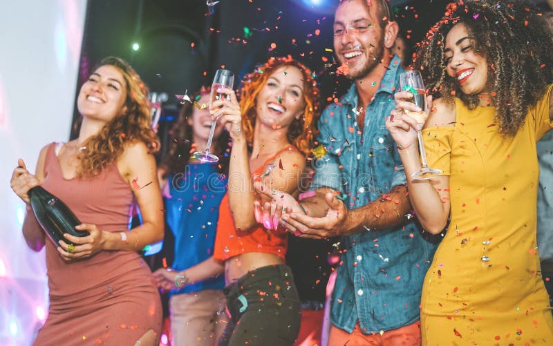 Happy friends doing party drinking champagne and dancing in the club - Millennials young people having fun celebrating royalty free stock photos Happy friends doing party drinking champagne and dancing in the club - Millennials young people having fun celebrating royalty free stock photos