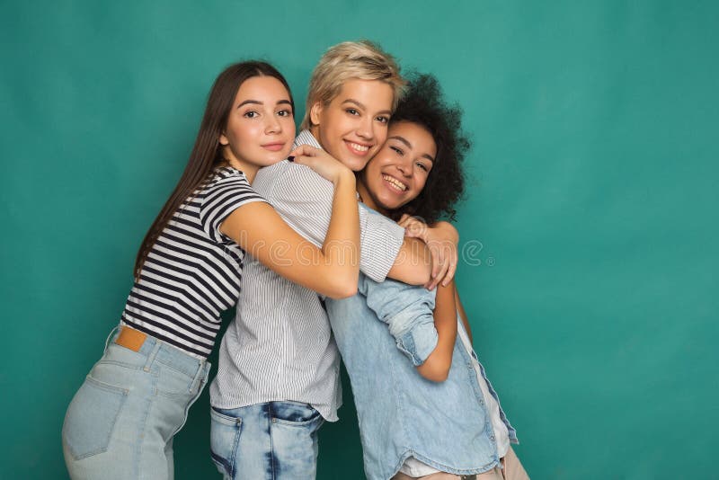Happy friends having fun at blue background stock photos Happy friends having fun at blue background stock photos