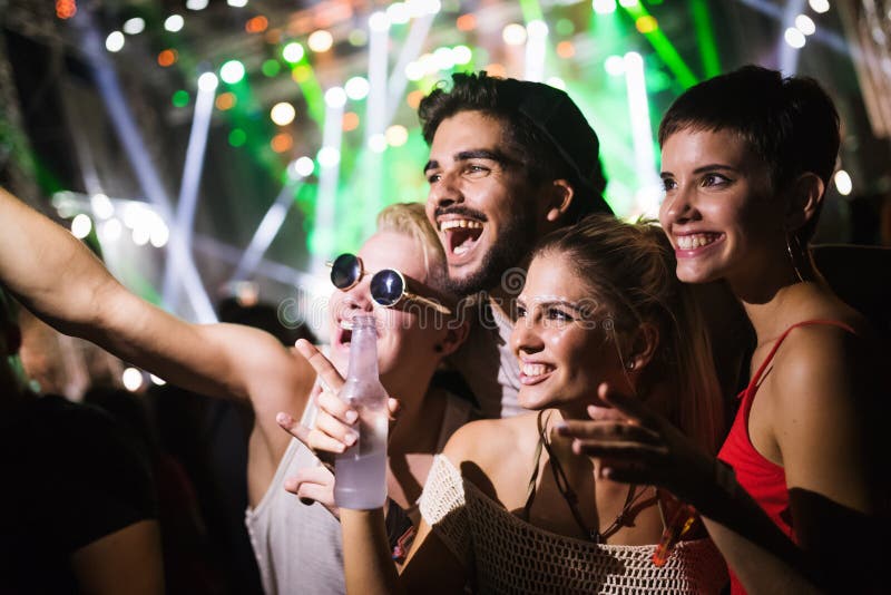 Happy Friends Having Fun at Music Festival Stock Photo - Image of ...