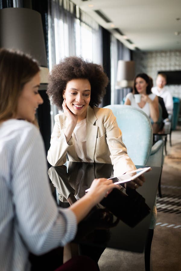 Happy friends having a good conversation sitting in a restaurant stock images Happy friends having a good conversation sitting in a restaurant stock images