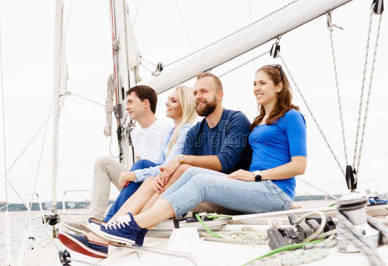 Happy friends traveling on a yacht. Sailing, motorboat.