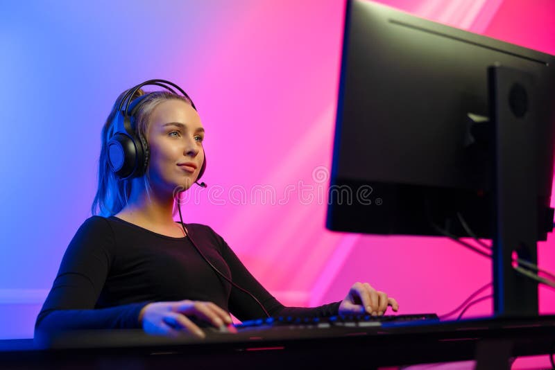 Happy Pretty Blonde Gamer Girl Playing Online Video Game on Her Personal  Computer Stock Photo - Alamy