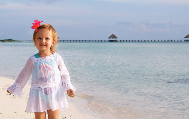 A happy girl on the beach royalty free stock photos
