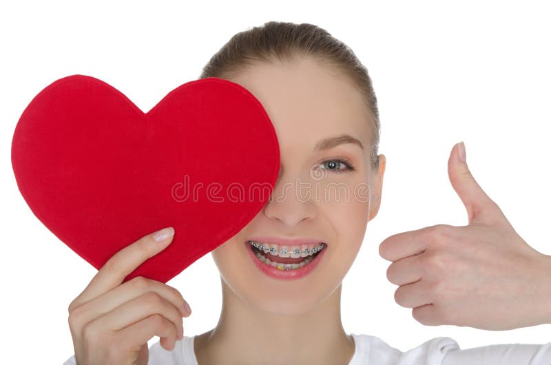 Happy girl with braces and heart