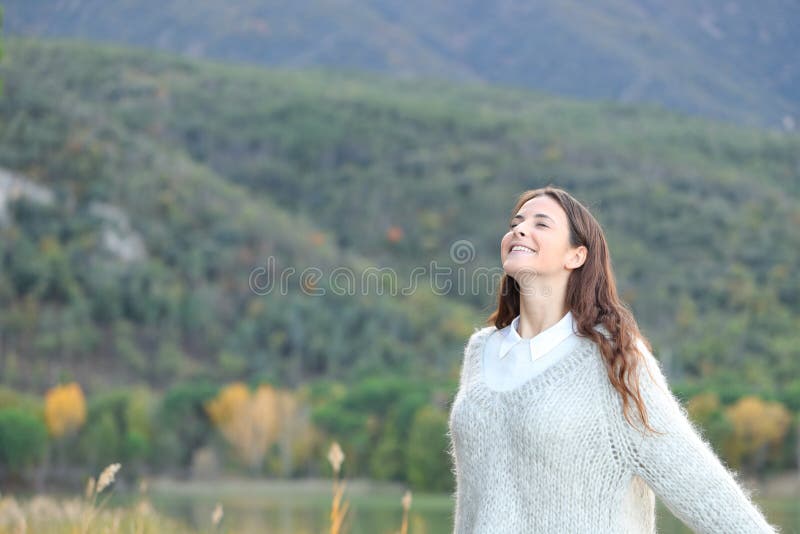 Happy girl breaths fresh air in the mountain royalty free stock photography Happy girl breaths fresh air in the mountain royalty free stock photography