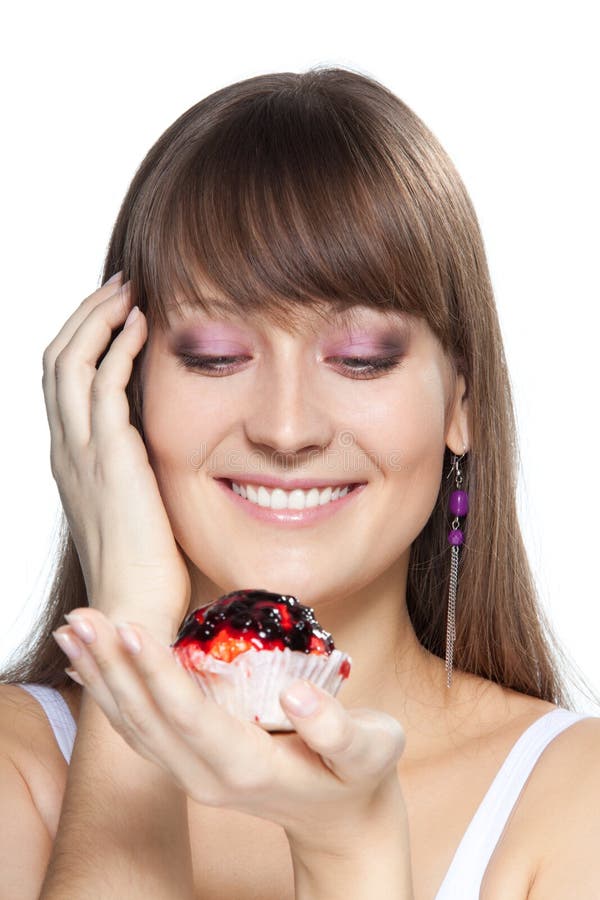Girl With A Cake For A Birthday, In The Studio On A Pink Background