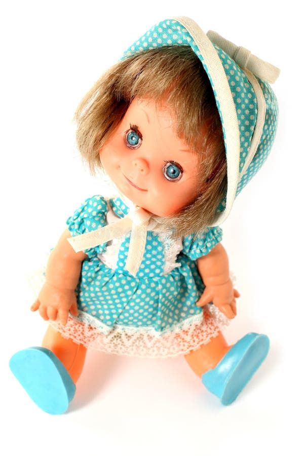 Happy girl doll sitting