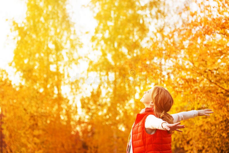 Happy Woman Enjoying Life in the Autumn on the Nature Stock Photo