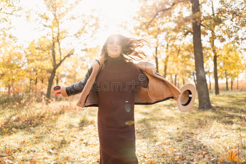 Happy Woman Enjoying Life in the Autumn on the Nature Stock Photo