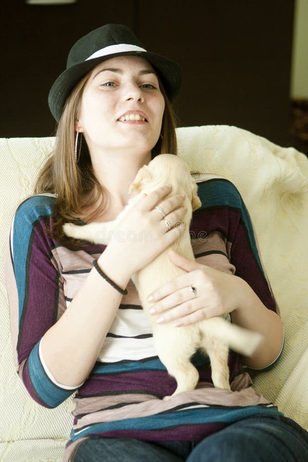 Happy Girl With Funny Puppy On Couch Stock Image - Image Of Long
