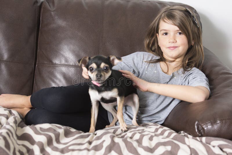 Happy Girl with His Dog on Sofa Stock Photo - Image of funny, cozy ...