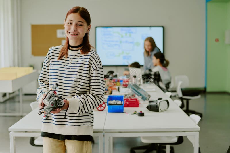 Happy Girl Holding Robot for Photo stock photography