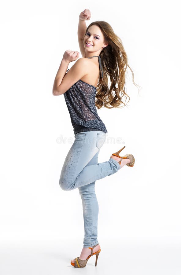 Happy girl in jeans posing at studio royalty free stock photos