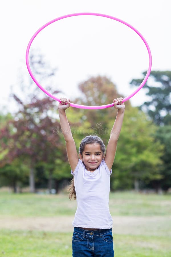 Happy Girl Playing with Hula Hoops Stock Photo Image of countryside