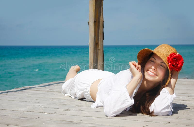 Happy girl relaxing on sea background