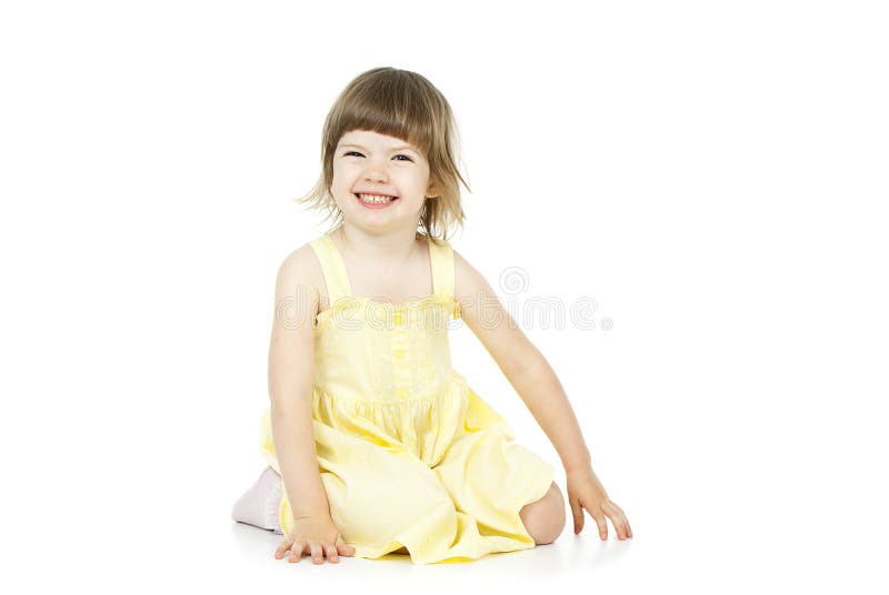 Happy girl sitting on the floor