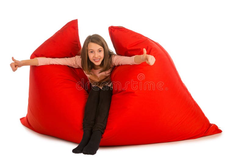 Happy girl sitting on red beanbag sofa for living room or other