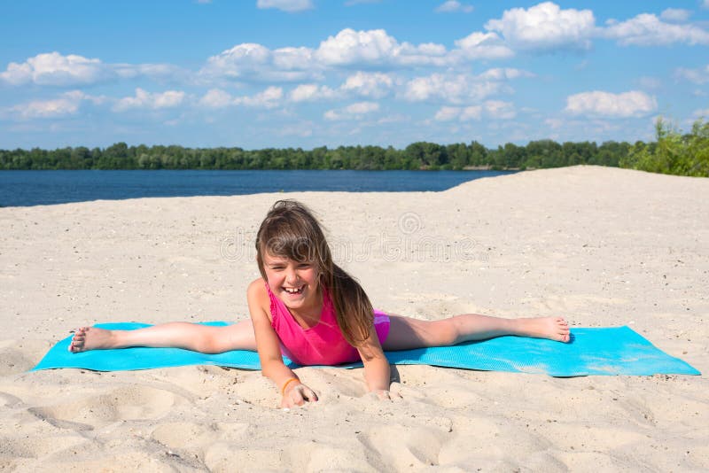 Happy Girl on a Yoga Mat Doing Gymnastics on the Beach. Active Life Style  Stock Image - Image of outdoor, life: 190947171