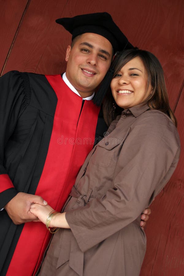 Happy graduate with his partner stock photos