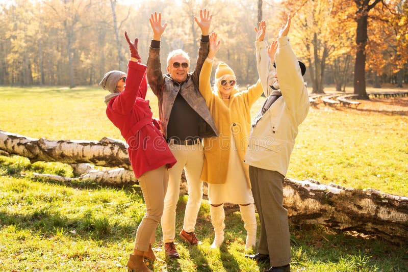 Happy Group Of Old Senior Friends Having Fun In Autumn Park Stock Image